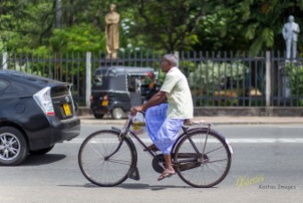 Bicycles, Tricycles, Motorcicles were vastly used in the streets of Sri Lanka. I'm sure they enjoy the fresh air and avoid the traffic jams at the same time. Galle, Sri Lanka.
