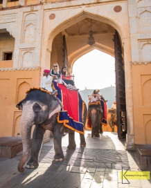 Tourists entering the Amber Palace in Jaipur, on elephants (thus the huge doors).
