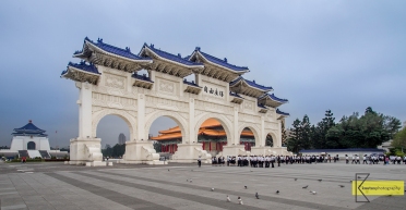 Comparing sizes: A group of students close to the huge gate at 中正紀念堂 Chiang Kai-shek Memorial Hall, Taipei, Taiwan